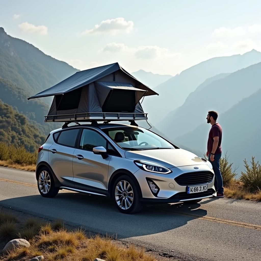 Ford Fiesta mit Dachzelt in den Alpen