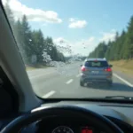 Steinschlag im Sichtfeld einer Carglass-Scheibe