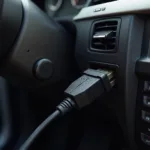 OBD-Adapter angeschlossen an einen BMW.